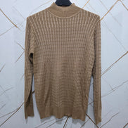 Maglione Donna in Tessuto a Coste Colore Beige con Maniche Lunghe e Collo Alto per un Look Elegante e Comfortevole